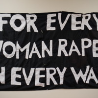 10-032_S2-F7-I1_Banner_For Every Woman Raped in Every War.JPG