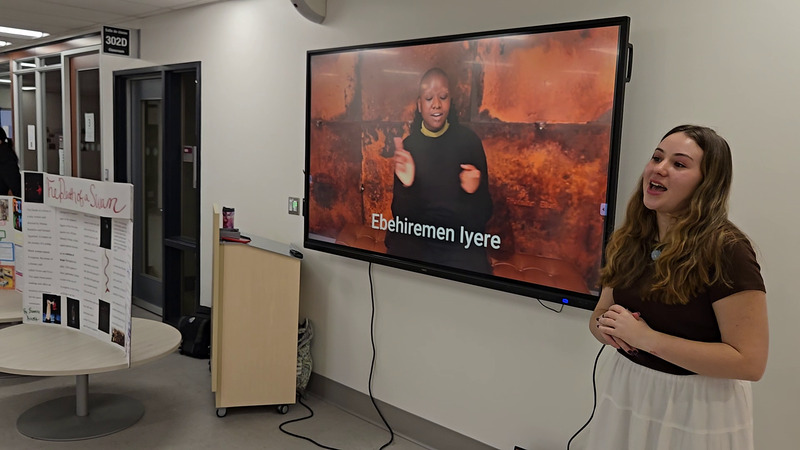 Breanna_with_exhibit.png Breanna_with_exhibit.png