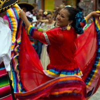 Mexican Dancers - Dancing woman dancing in traditional dress at the celebration