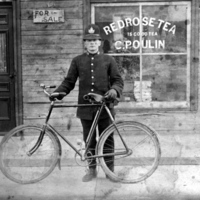 Police officer James Fagan is posing outside C Poulin's store at 324 Rochester St - City of Ottawa Archives CA001216.jpg