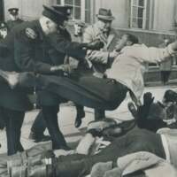 police tossing a man into a pile of protesters.jpg